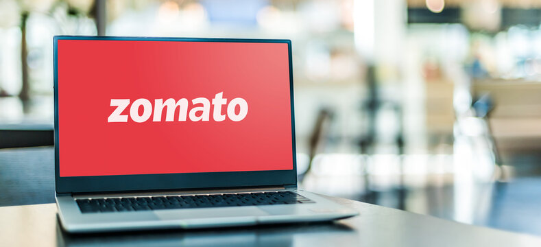 Laptop computer displaying logo of Zomato