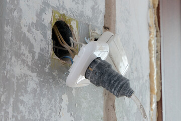 danger wire connection of the cable to an electrical socket.