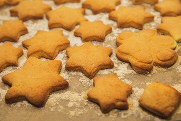 homemade shortbread in the shape of star on baking sheet