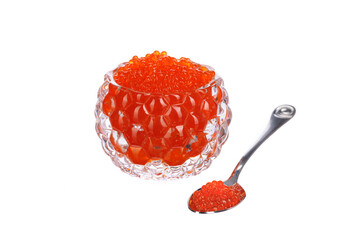 red caviar in a caviar bowl with a spoon standing next to it on a white isolated background