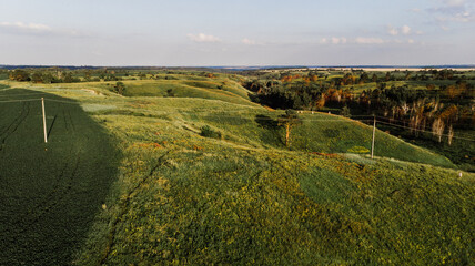 Naklejka premium Nice view of the ravine and hills from the drone at sunset.