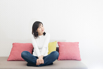Woman sitting cross-legged on the couch