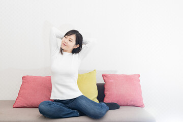 Woman stretching on the sofa