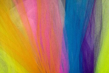 Mesh fabric in different colors. Net-like appearance fabric. Abstract multicolored backdrop
