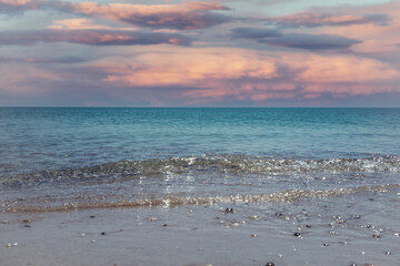 Fototapeta na wymiar Seascape with a beautiful pink sunset.