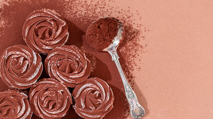 Delicate zephyr sprinkled with cocoa powder. Low-calorie marshmallows. Homemade dessert.