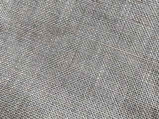 Burlap texture for background.  Natural gray fabric.  Flat lay, copy space, wallpaper.