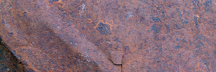 Background of rusty metal texture with traces of corrosion. Panorama.