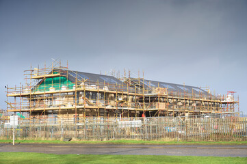 House development construction site in progress with scaffold