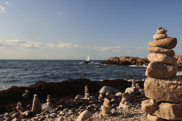 stone towers stacked on the shore of the Baltic Sea on the island of Bornholm