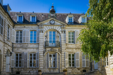 Fototapeta na wymiar Impressive facade of a rich mansion in the historic center of Bourges, a city located in the Berry Region of France