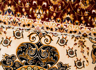 Group of luxurious carpets stacked