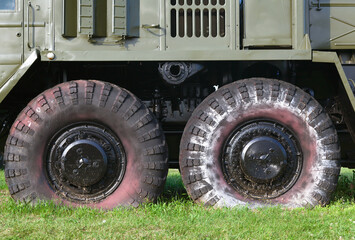 Military vehicle wheels close up - 409443517