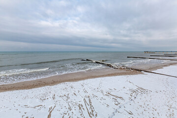 Winter seascape with Baltic Sea waters, horizon and cloudy sky in Kaliningrad region, Russia