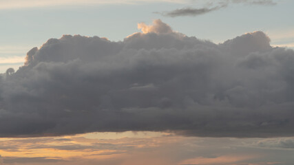 Naklejka na ściany i meble clouds on evening sky with sunset light