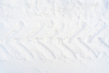 Texture trace from tractor tires on snow after a snowstorm