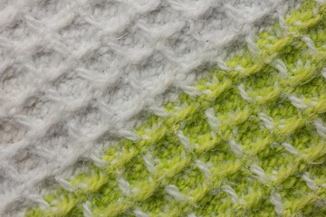 Green and white colored woven cloth macro close up diagonal view