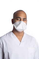 Portrait of young black male health professional wearing white scrub and mask in white background