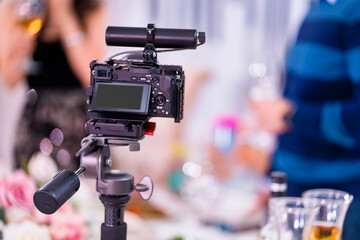 video camera on a tripod. installation of equipment for shooting events and holidays. professional shooting.