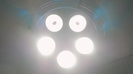 Surgical lamp in the operating room. Close-up. The surgical light turns on.