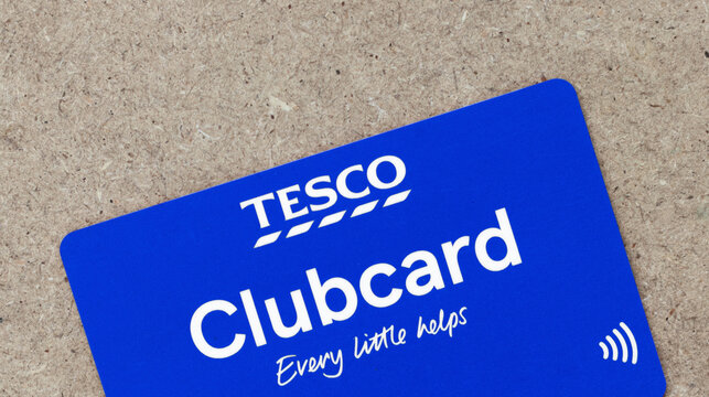 Contactless Tesco loyalty card on a brown textured background - London, UK - 14th May 2019 