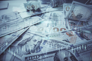 Multi exposure of forex chart drawing over us dollars bill background. Concept of financial success markets.