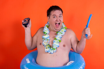 Vacation and holidays funny fat man with a rubber ring.