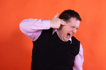 Emotions of a funny fat businessman. Orange background.