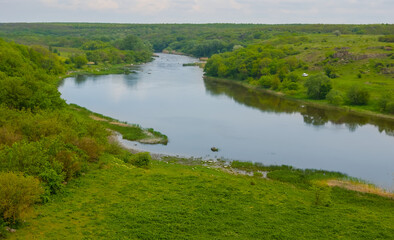 river rushing among green hills, summer mountain canyon landscape