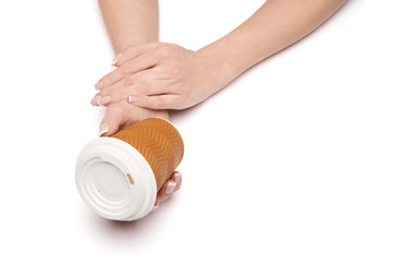 Female hand with paper cup of coffee isolated on white with clipping path