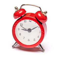 Red vintage alarm clock isolated on white background with clipping path