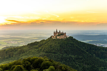 Fototapeta na wymiar View on Hohenzollern castle from the hill Zellernhorn during sunset