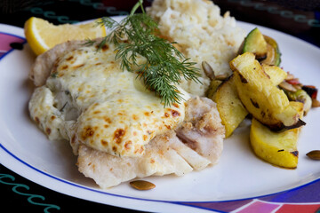 Cod fish with roasted vegetables and rice pilaf reflects healthy and balanced meal