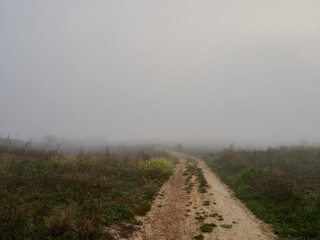 abandoned roads with fog next to the Bellus reservoir, in the surroundings of the village of Guadasequies, Spain.
