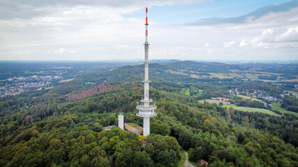 Obraz premium Television tower in a green forest