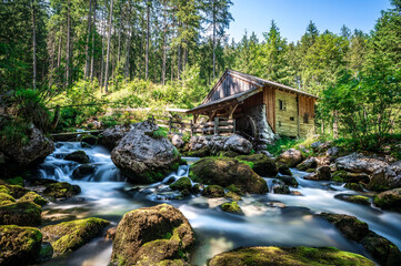 Fototapeta na wymiar Old water mill near Gollinger waterfall south of Salzburg with long exposure