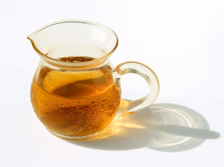 Cold black tea with glass tea pot, tiny drops of moisture have formed, beads of sweat, water drops