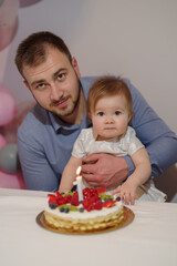 Father and daughter at her first birthday party