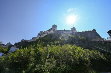Castle Hohensalzburg on a hill in Salzburg on sunny day from below