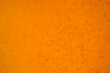 Defocused of orange bubbles textures close up as backgroud 