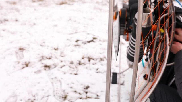Close up of detail of propeller, motor, engine of the paramotor paraglider, Getting ready to fly off.