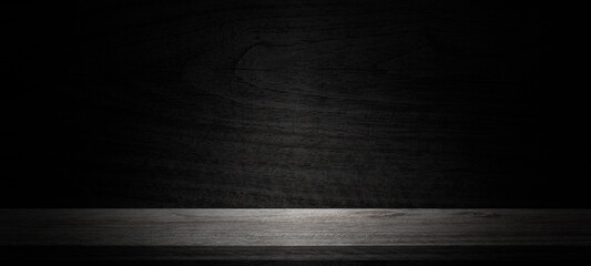 Empty wooden table on wall dark background,perspective wooden floor shelf table,used as a studio background wall to display your products.