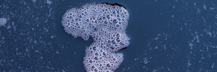 Grape juice close up during the autumn harvest. Traditional old technique of wine making. Filtering grape must.