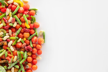 Frozen vegetables on a white background with copy space.