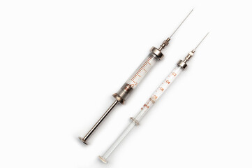 two reusable injection syringes. isolated on white background. place for inscription.