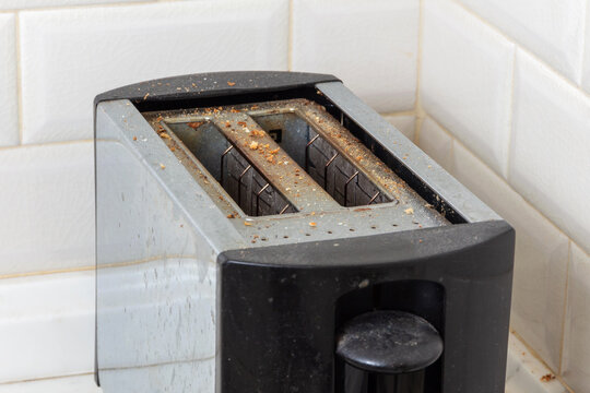 Dirty toaster with crumbs