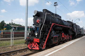The locomotive of the last century standing under steam