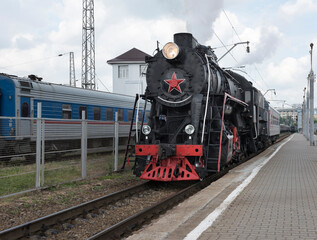 The locomotive of the last century standing under steam