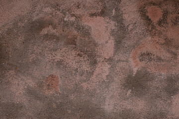 Old retro scrutched red pink brown plaster stucco wall background