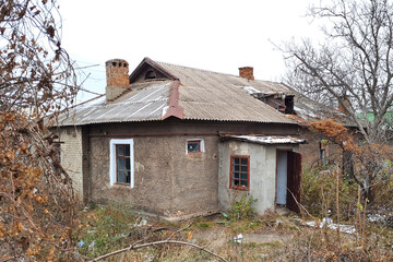 Fototapeta na wymiar abandoned destroyed old brick house on countryside.